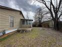 Backyard features screened porch and mature trees at 3143 Cedar St, Scottdale, GA 30079
