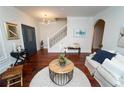 Inviting foyer with hardwood floors, staircase, and a stylish entryway at 550 Quillian Ave, Decatur, GA 30032