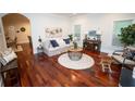 Bright living room featuring hardwood floors, neutral decor, and large windows at 550 Quillian Ave, Decatur, GA 30032