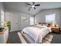 Serene main bedroom with neutral walls, ceiling fan, and bright natural light at 5937 Yellowood Ct, Atlanta, GA 30349