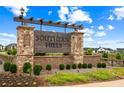 Stone entrance to Southern Hills neighborhood with wood sign and landscaping at 1049 Climbing Rose Way, Mcdonough, GA 30253