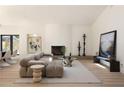 Bright and airy living room with fireplace, wall art, and comfortable tan sectional sofa at 1130 Mclinden Se Ave, Smyrna, GA 30080