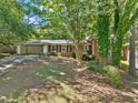 Quaint single-story brick home with green foliage at 1425 Dalewood Ne Dr, Atlanta, GA 30329