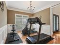 Bright exercise room with modern equipment and hardwood floors at 315 Glengarry Chase, Covington, GA 30014