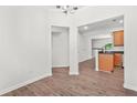 Bright, open-concept space featuring hardwood floors and seamless flow between dining area and adjacent kitchen at 2348 Bigwood Trl, Atlanta, GA 30349
