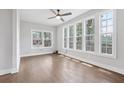 Bright living room with hardwood floors and large windows providing ample natural light at 2411 Second Ave, Decatur, GA 30032