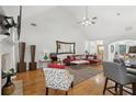 Spacious living room featuring vaulted ceiling, hardwood floors, and modern decor and plenty of seating at 2825 Ellenwood Village Way, Ellenwood, GA 30294