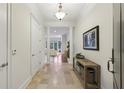 Inviting entryway with tile flooring, decorative lighting, and an open view into the living area at 3280 Stillhouse Se Ln # 212, Atlanta, GA 30339