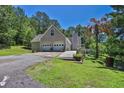 Shot of the garage with level driveway and wheelchair access ramp to the side at 3909 Laurens Ln, Snellville, GA 30039