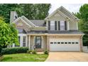Beautiful two-story home with a brick-accented facade, an attached garage, and a well-maintained front lawn at 4000 Mcpherson Drive, Acworth, GA 30101