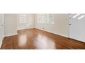 Inviting living room with gleaming hardwood floors and neutral paint at 4400 Hickory Wood Ln, Atlanta, GA 30360