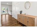 Home's entrance foyer with hardwood floors and modern console at 150 Ivy Chase Loop, Dallas, GA 30157