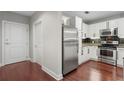 Kitchen with stainless steel appliances, white cabinets and a dark backsplash at 325 E Paces Ferry Ne Rd # 313, Atlanta, GA 30305