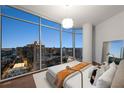 Stunning bedroom featuring floor-to-ceiling windows with city views, providing abundant natural light and a captivating ambiance at 1065 Peachtree Ne St # 3504, Atlanta, GA 30309