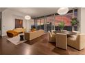 Bright living room with floor-to-ceiling windows showcasing city views and elegant furnishings at 1065 Peachtree Ne St # 3504, Atlanta, GA 30309