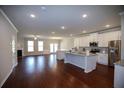 Open-concept kitchen and living area featuring granite countertops and stainless steel appliances at 2304 Shetley Creek Dr, Norcross, GA 30071