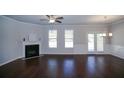 Inviting living room with fireplace, hardwood flooring, and stylish lighting at 2304 Shetley Creek Dr, Norcross, GA 30071