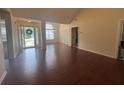 Spacious living room featuring hardwood floors, a large window, and neutral walls at 2840 Alcovy River Vw, Dacula, GA 30019