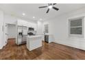 Bright, remodeled kitchen with stainless appliances, white cabinetry and butcher block island at 360 Ponce De Leon Ave Ne # 1, Atlanta, GA 30305
