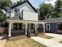 Charming two-story home with a covered front porch, nice columns, and freshly landscaped yard at 1090 Mcdaniel St, Atlanta, GA 30310