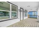 Inviting covered front porch with wood decking and stylish lighting fixtures and nice columns at 1090 Mcdaniel St, Atlanta, GA 30310