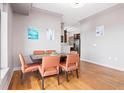 Well lit dining area features seating for six with hardwood floors and easy access to kitchen at 3445 Stratford Ne Rd # 903, Atlanta, GA 30326