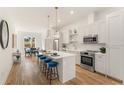 Bright open kitchen with stainless steel appliances, a center island, and a breakfast bar at 1237 Memorial Se Dr # 404, Atlanta, GA 30316