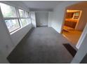 A bright living room featuring ample windows and an open doorway to the kitchen at 3252 Pinehill Dr, Decatur, GA 30032