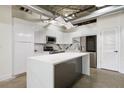 Modern kitchen featuring white cabinets, a kitchen island and stainless steel appliances at 505 Whitehall Sw St # 102, Atlanta, GA 30303
