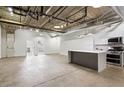 Spacious kitchen features white cabinets, an island and stainless steel appliances at 505 Whitehall Sw St # 102, Atlanta, GA 30303