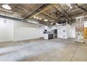 Spacious living room and kitchen area features industrial design elements and concrete floors at 505 Whitehall Sw St # 102, Atlanta, GA 30303