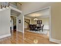 Elegant dining room with hardwood floors, a chandelier, and space for Gathering gatherings at 5980 Whitestone Ln, Suwanee, GA 30024