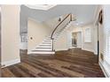 Spacious foyer with beautiful wood floors and a grand staircase at 971 Ashebrooke Ne Ct, Marietta, GA 30068