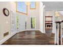 Elegant foyer featuring hardwood floors, fireplace view, and ample natural light at 971 Ashebrooke Ne Ct, Marietta, GA 30068