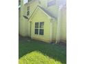 View of home's rear exterior with classic siding and a well-maintained yard at 2581 Star Ln, Decatur, GA 30034
