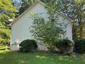 The side of the home with lush landscaping creates a sense of privacy at 2581 Star Ln, Decatur, GA 30034