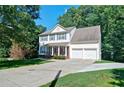 Traditional two-story home with attached garage, set on a large lot at 809 Longbranch Ln, Douglasville, GA 30134
