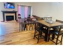 Cozy living room with fireplace, wood flooring, and comfortable seating area at 1144 Country Ct, Lawrenceville, GA 30044