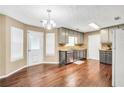 Bright kitchen boasts stainless steel appliances and tile backsplash at 130 Nicki Ct, Hampton, GA 30228