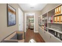 Well-organized office space featuring built-in shelving and hardwood floors at 130 Nicki Ct, Hampton, GA 30228
