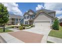 Lovely two-story home with large driveway, lawn, and mature trees at 675 Mallard Cv, Loganville, GA 30052