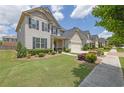 Beautiful home with lush lawn and garden beds at 675 Mallard Cv, Loganville, GA 30052