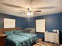 Cozy bedroom features hardwood floors, natural light, and neutral walls at 224 Potts Se Rd, Conyers, GA 30094