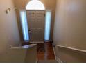 Inviting entryway featuring light walls, tile flooring, and large front door at 318 Summit View Dr, Mcdonough, GA 30253