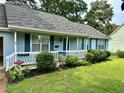 Lovely single story home showcasing beautiful curb appeal and manicured lawn at 60 Parkman Trl, Covington, GA 30016