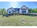 Craftsman-style home with a well-manicured front lawn and landscaping at 2750 Herrington Dr, Cumming, GA 30041