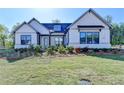 Beautiful single Gathering home with verdant lawn and landscaping at 2750 Herrington Dr, Cumming, GA 30041