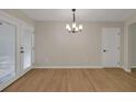 Spacious living area featuring beautiful hardwood floors, neutral walls, and a lot of natural light at 589 Wilmont Dr, Jonesboro, GA 30238