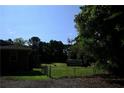 Expansive backyard featuring a secure chain-link fence, offering ample space and privacy at 1621 Oak Rd, Snellville, GA 30078