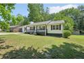 Exterior view of the home and the large front yard at 3388 Hamilton Mill Rd, Buford, GA 30519